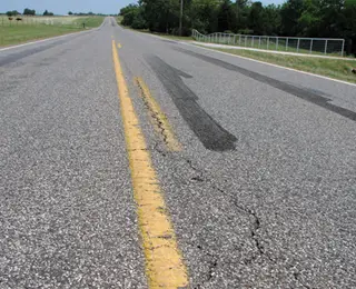 Tire burnout marks on a country road