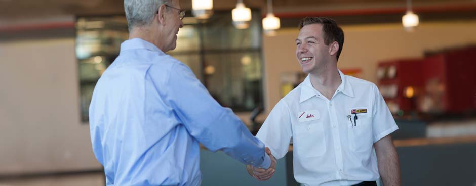 Employee shaking hands with customer