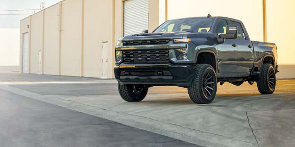 White pickup with a lift kit installed