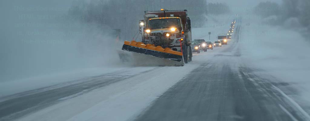 Mechanic working on a vehicle's brakes.