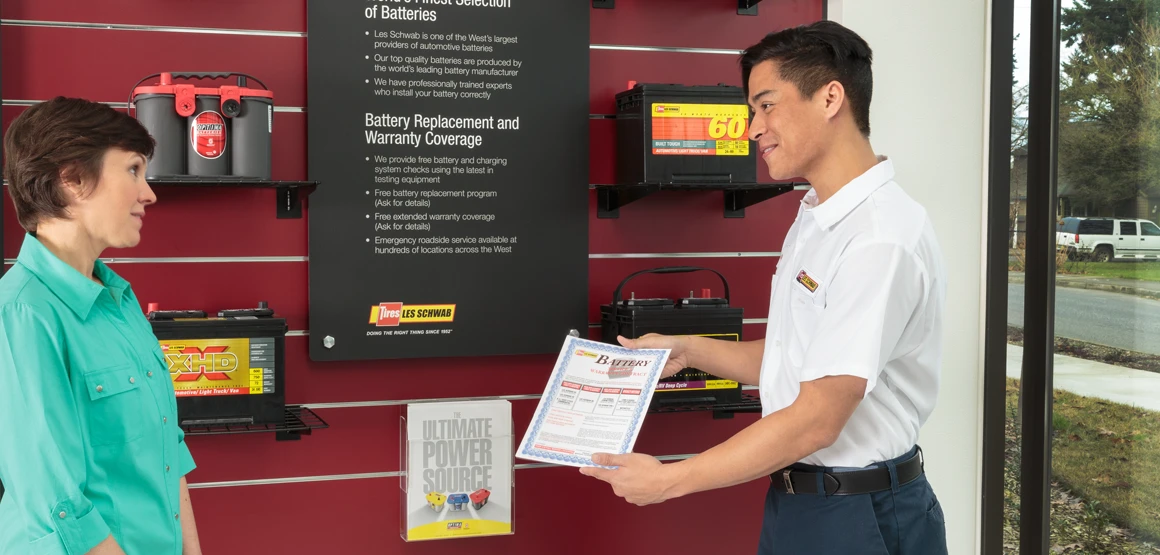 Les Schwab employee talking with a customer