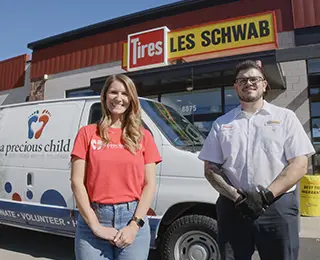 Les Schwab manager with A Precious Child's Chief Communications Officer
